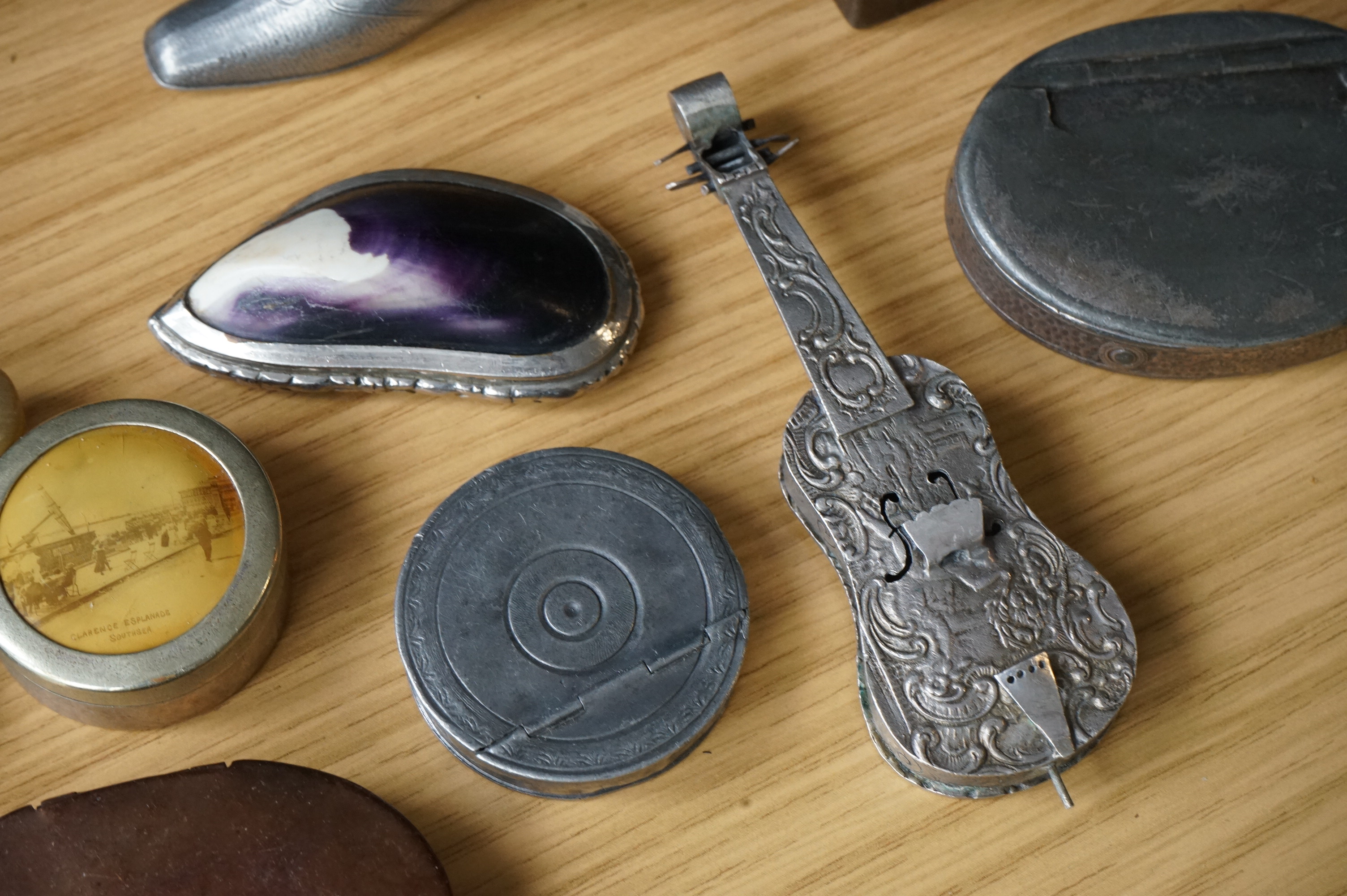 A collection of mixed metal stuff boxes including a novelty cello shaped box being 12cm long